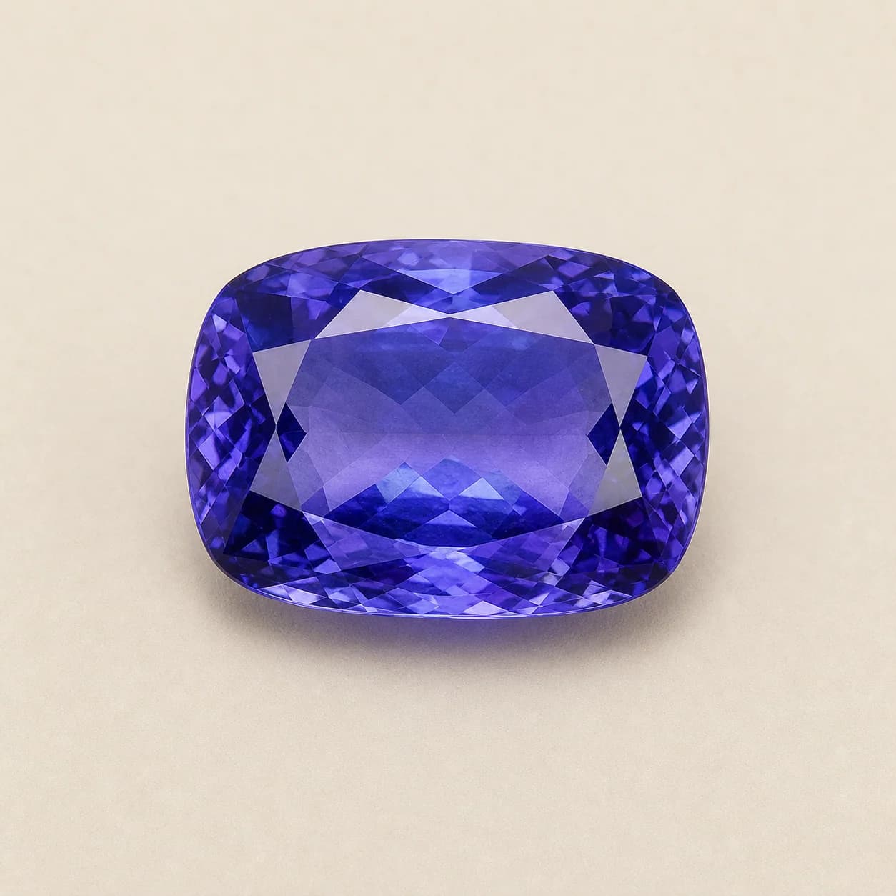 Tanzanite 7.85ct loose gemstone on a warm ivory background